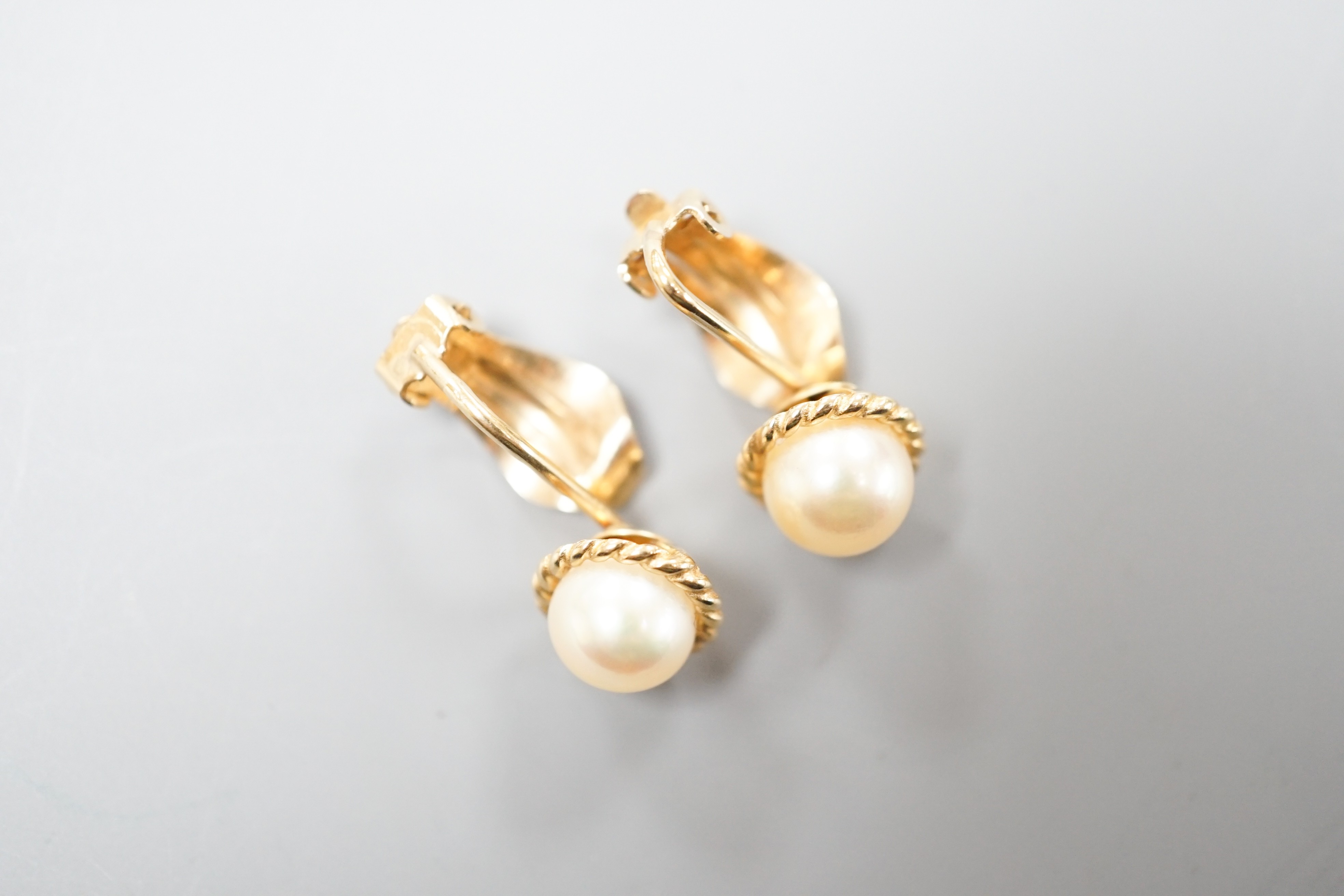 A pair of 9c and cultured pearl ear clips, 17mm, gross weight 3.1 grams.